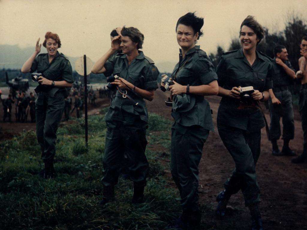 The ‘Fab Four’ ... Lieutenant Collen Mealy (second from right) with, from left, Lieutenant Margaret Ahern, Captain Amy Pittendreigh and Lieutenant Terrie Roche, watch 2 RAR leave on a heliborn assault.