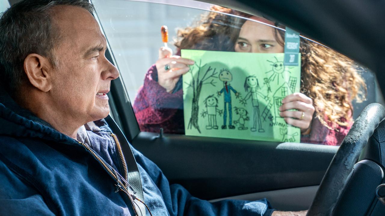 Otto (Tom Hanks) is loathe to react to the picture Marisol's (Mariana Trevino) kids drew in A Man Called Otto. Picture: Columbia Pictures