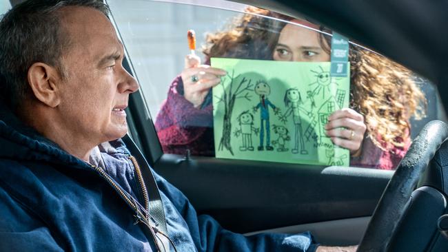 Otto (Tom Hanks) is loathe to react to the picture Marisol's (Mariana Trevino) kids drew in A Man Called Otto. Picture: Columbia Pictures