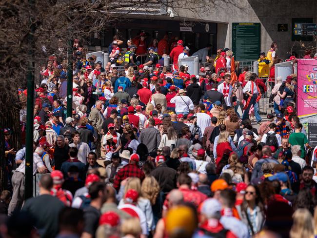 MELBOURNE, AUSTRALIA - NewsWire Photos - 28 September, 2024 AFL GRAND FINAL  Pictured Fans and crowds arrive for the final Sydney Swans vs Brisbane LionsPicture: NewsWire/Nadir Kinani