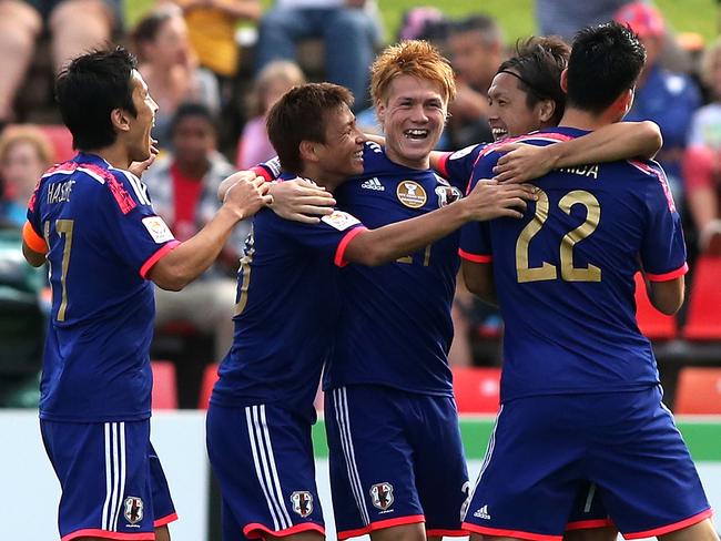 NEWCASTLE, AUSTRALIA - JANUARY 12: Japan players celebrate a goal during the 2015 Asian Cup match between Japan and Palestine at Hunter Stadium on January 12, 2015 in Newcastle, Australia. (Photo by Tony Feder/Getty Images)