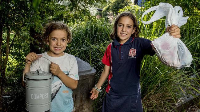 Children Adam Hirshberg, 7, and Libi Hirshberg, 10 showing how little waste their family produces each month. Picture: Jerad Williams