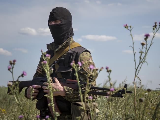 A member of a local militia guards access to the wreckage of Malaysia Airlines flight MH17. Picture: Rob Stothard/Getty Images