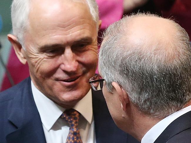 PM Malcolm Turnbull congratulates Treasurer Scott Morrison after delivering the 2017 Budget in the House of Representatives Chamber, in Parliament House, Canberra. Picture Kym Smith