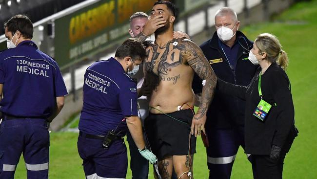 Frightening moment as Sharks prop Andrew Fifita is surrounded by medical staff after taking a hit to the throat. Picture: AAP