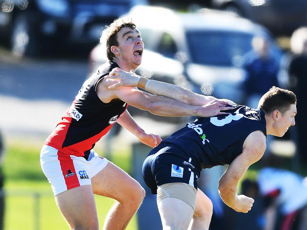 Riley Thilthorpe (left) competes for the footy during the match against South Adelaide and West Adelaide. Picture: Mark Brake