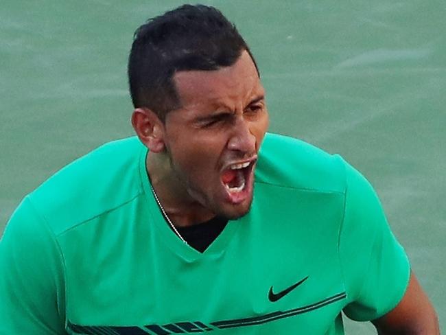 INDIAN WELLS, CA - MARCH 15: Nick Kyrgios of Australia celebrates match point against Novak Djokovic of Serbia in their fourth round match during day ten of the BNP Paribas Open at Indian Wells Tennis Garden on March 15, 2017 in Indian Wells, California.   Clive Brunskill/Getty Images/AFP == FOR NEWSPAPERS, INTERNET, TELCOS & TELEVISION USE ONLY ==