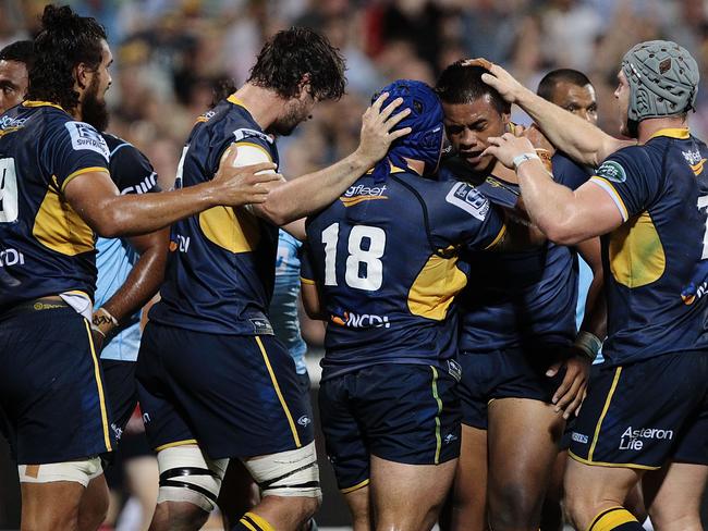 Brumbies players celebrates a try against the Waratahs on Friday night.