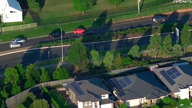 The black station wagon (behind the red car) was captured on PolAir. Picture: NSW Police