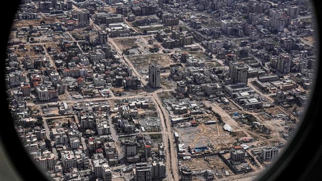 The Star of David is etched in an empty lot surrounded by destroyed buildings in the Gaza Strip, as seen from the porthole of the US Air Force 26th Expeditionary Rescue Squadron HC-130J aircraft during an airdrop mission of humanitarian aid, amid the ongoing conflict between Israel and the Palestinian Hamas movement. Picture: AFP