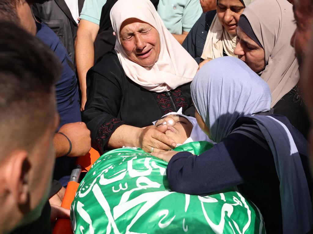 Relatives mourn during the funeral of 16-year-old Mohammed Odwan, who died as a result of injuries sustained during clashes near the town of Tulkarem in the north of the occupied West Bank on October 15. Picture: AFP