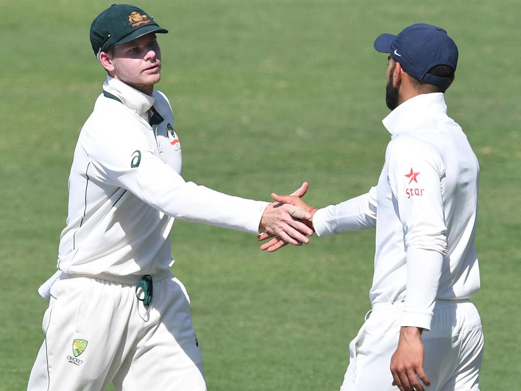 Steve Smith and Virat Kohli shake hands after their controversy in 2017.