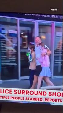 Children wear eye masks as they leave Bondi Junction Westfield