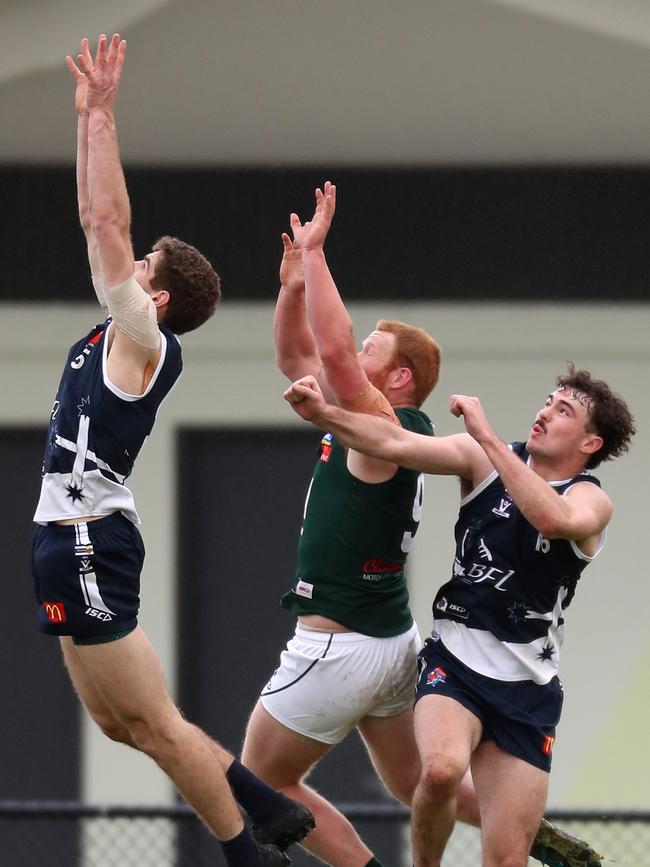 Ballarar’s Riley O'Keefe rises the highest to try to mark the ball. Picture Yuri Kouzmin