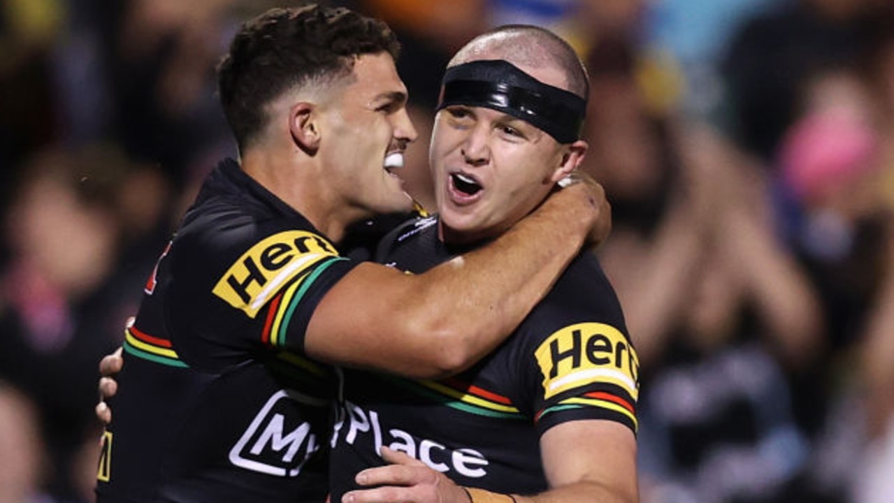 PENRITH, AUSTRALIA - MARCH 15: Dylan Edwards of the Panthers celebrates scoring a try with Nathan Cleary of the Panthers during the round two NRL match between Penrith Panthers and Parramatta Eels at BlueBet Stadium, on March 15, 2024, in Penrith, Australia. (Photo by Jason McCawley/Getty Images)