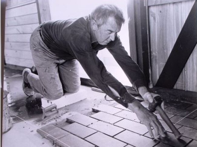 Frank Dixon laying the kitchen tiles in 1978. Picture: The Herald