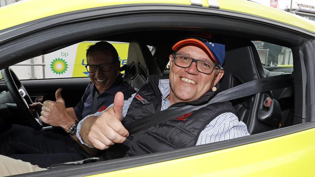 Prime Minister Scott Morrison with Mark Skaife (at the wheel) about to go for a lap around the track while visiting Mount Panorama on Saturday at the Repco Bathurst 1000. Picture: Tim Hunter.