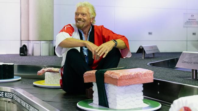 Richard Branson joins a giant sushi train at Brisbane Airport on Thursday. Picture: Jen Dainer