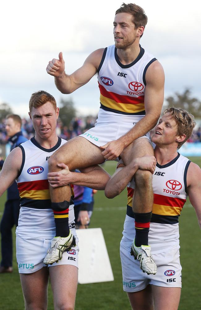 Richard Douglas gets chaired off after his final game. Picture: Michael Klein