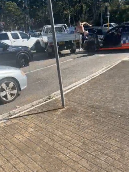 A shirtless driver then jumped out of the car and ran down the road. Picture: TikTok