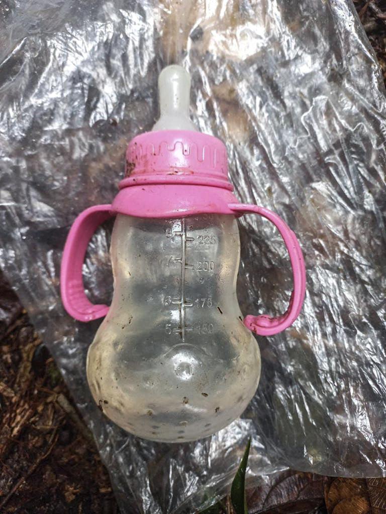 Scissors, shoes, and a baby’s bottle were found in the jungle during the search. Picture: Handout / Colombian Army / AFP