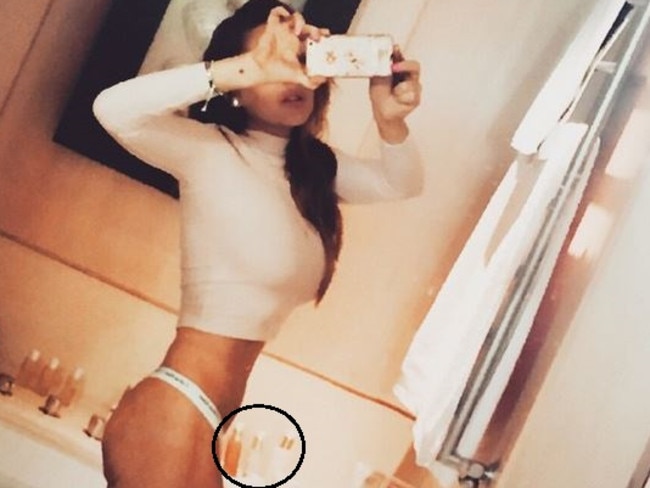 Suspicious ... bottles on the sink to the right of the actor seem weirdly slanted. Picture: Instagram/Lindsay Lohan