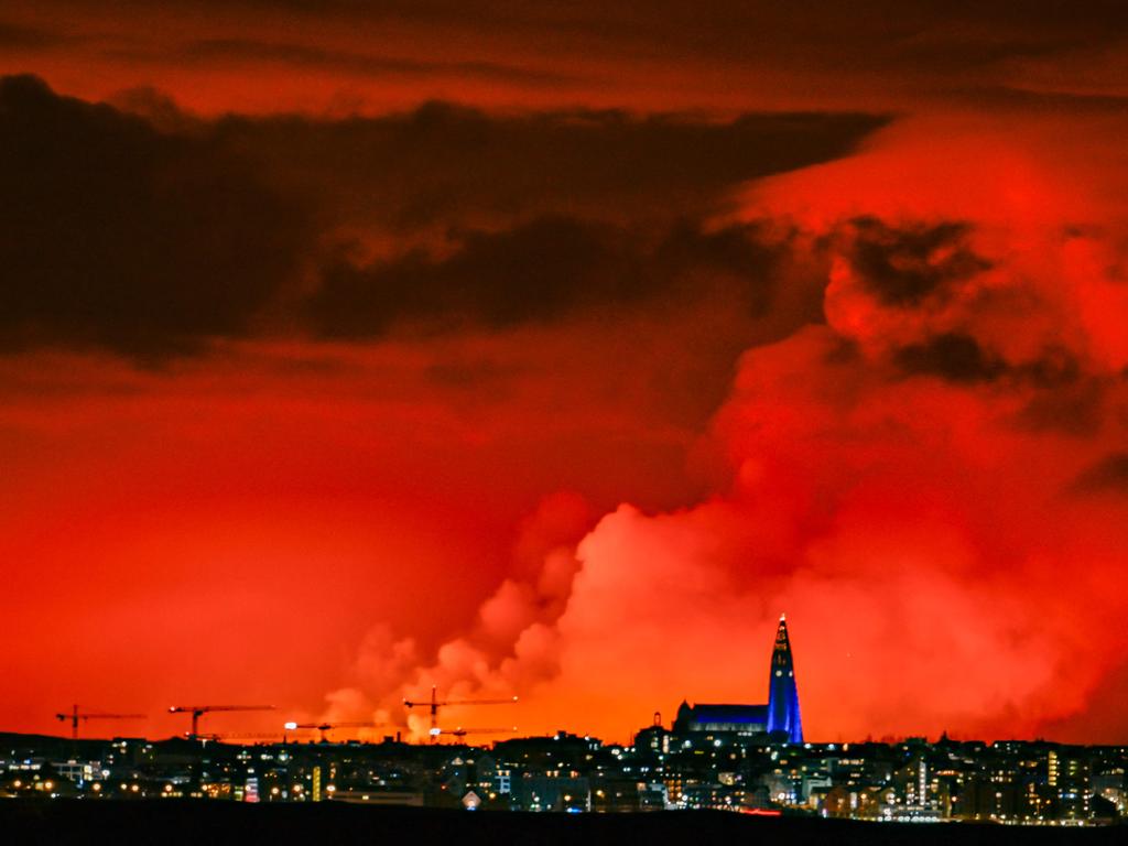 This photograph shows the skyline of Reykjavik against the backdrop of orange coloured sky due to molten lava flowing out from a fissure on the Reykjanes Peninsula, the fourth eruption to hit the area since December, north of the evacuated town of Grindavik, western Iceland on March 16, 2024. Picture: AFP