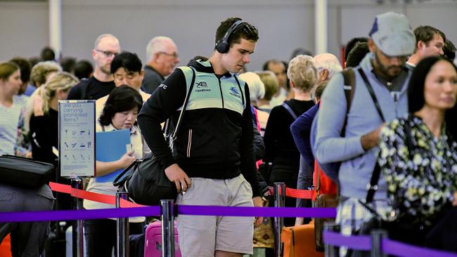 Passengers queue to check in at Sydney Airport on Wednesday. Picture: AAP/Brendan Esposito