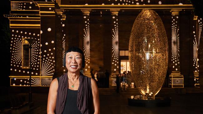 Artist Lindy Lee with her sculpture The Life of Stars outside the Art Gallery of South Australia in Adelaide. Picture: Matt Loxton / AAP