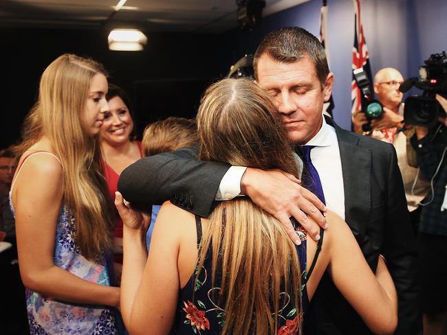 Baird hugs his family, with whom he wants to spend more time. Picture: Dylan Robinson