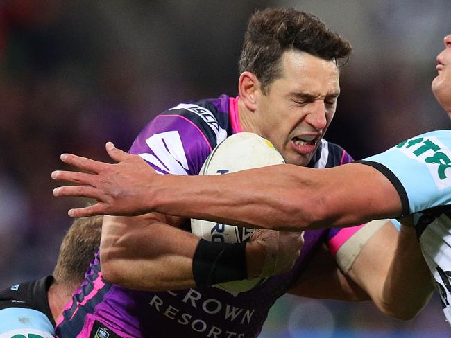 MELBOURNE, AUSTRALIA - AUGUST 12:  Billy Slater of the Storm is tackled during the round 22 NRL match between the Melbourne Storm and the Cronulla Sharks at AAMI Park on August 12, 2018 in Melbourne, Australia.  (Photo by Graham Denholm/Getty Images)