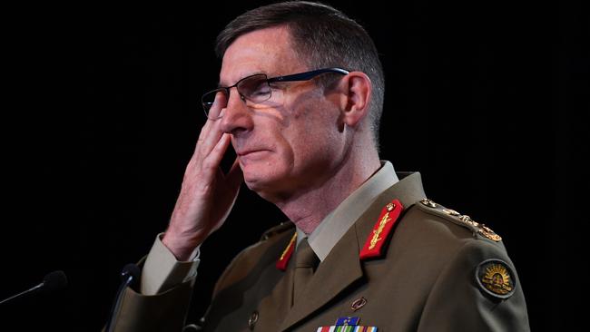 CANBERRA, AUSTRALIA : Chief of the Australian Defence Force (ADF) General Angus Campbell delivers the findings from the Inspector-General of the Australian Defence Force Afghanistan Inquiry on November 19, 2020 in Canberra, Australia. A landmark report has shed light on alleged war crimes by Australian troops serving in Afghanistan. (Photo by Mick Tsikas - Pool/Getty Images)