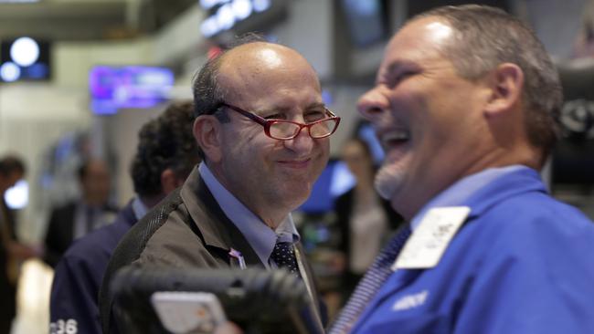 Andrew Silverman, left, and a fellow trader work on the floor of the New York Stock Exchange, Thursday, Aug. 27, 2015. U.S. stocks closed sharply higher after China's main stock index logged its biggest gain in eight weeks. The Dow Jones industrial average climbed 369.26 points, or 2. 3 percent, to 16,654.77. (AP Photo/Richard Drew)