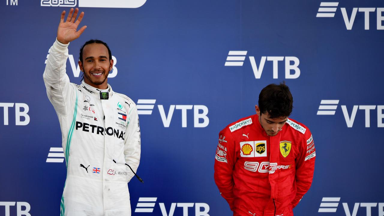 A dejected Charles Leclerc (R) on the podium with winner Lewis Hamilton. (Photo by Picture: Clive Mason