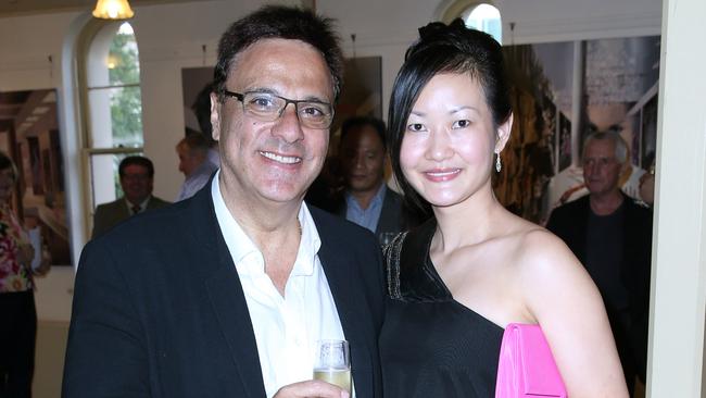 Michel Elias Germani, pictured with wife Coco Germani, is accused of orchestrating an armed robbery at his Germani Jewellery store. His wife is not accused of any wrongdoing or involvement.