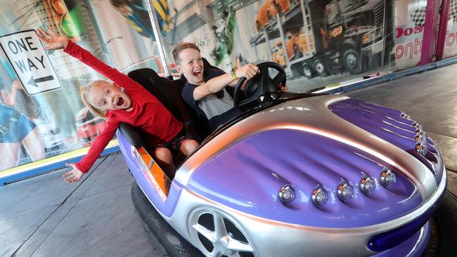 Paige and Flynn Fisher enjoy the dodgem cars. Photo by Richard Gosling