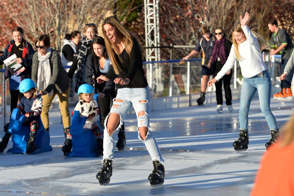 Ava Black (left) and Mykaila Saal ice skating at Winter Wonderland in the Civic Square, Friday, June 22, 2018. Picture: Kevin Farmer