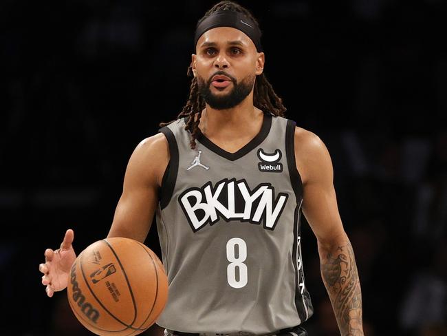 NEW YORK, NEW YORK - OCTOBER 25: Patty Mills #8 of the Brooklyn Nets dribbles during the second half against the Washington Wizards at Barclays Center on October 25, 2021 in the Brooklyn borough of New York City. The Nets won 104-90. NOTE TO USER: User expressly acknowledges and agrees that, by downloading and or using this photograph, user is consenting to the terms and conditions of the Getty Images License Agreement.   Sarah Stier/Getty Images/AFP == FOR NEWSPAPERS, INTERNET, TELCOS & TELEVISION USE ONLY ==