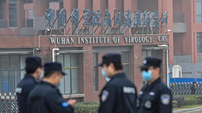 Security personnel stand guard outside the Wuhan Institute of Virology in Wuhan as members of the World Health Organisation team investigating the origins of the COVID-19 coronavirus make a visit to the institute in Wuhan.