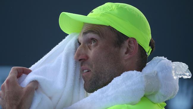 Ivo Karlovic of Croatia tries to cool off during first round match against Horacio Zeballos of Argentina on day two of the 2017 Australian Open. It ended as the longest match in tournament history, lasting 84 games.