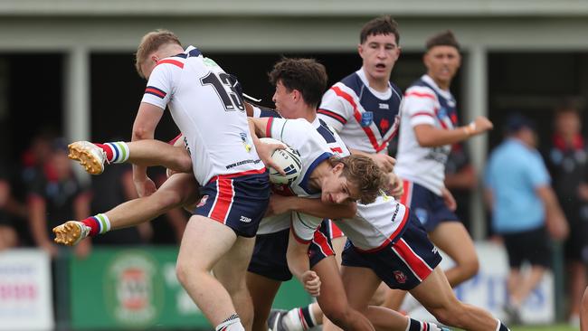 Aidan Wunsch is tackled by Alexander Stephenson. Johns Cup Central Coast Roosters v Monaro Colts Round One at Morry Breen Oval Central Coast Saturday 3rd February. pic Sue Graham