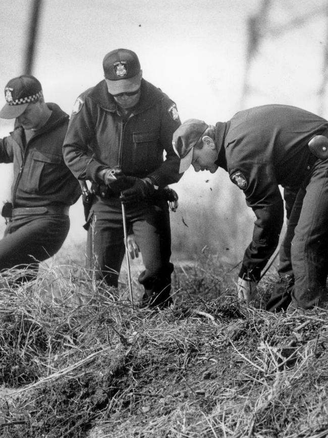 Police searching for evidence near where Karmein’s body was found.