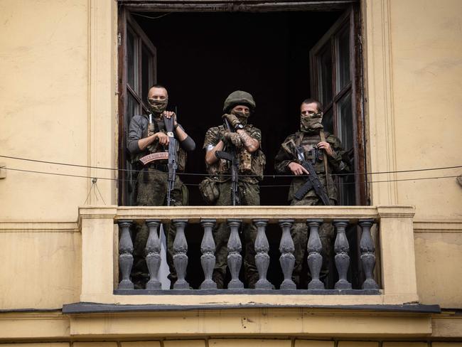 Members of Wagner group stand on the balcony of a building in Rostov-on-Don, during the attempted mutiny on June 24. Picture: Roman Romokhov/AFP