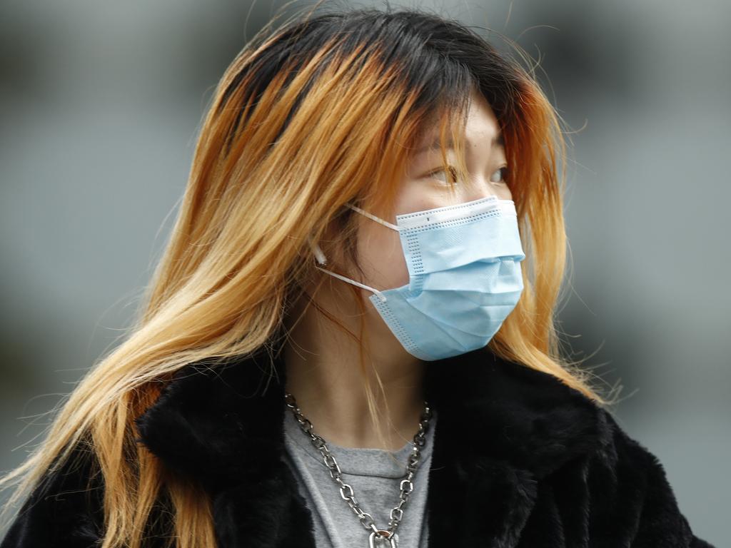 Surgical masks are effective in helping to reduce the risk of virus transmission, studies show. Picture: AAP
