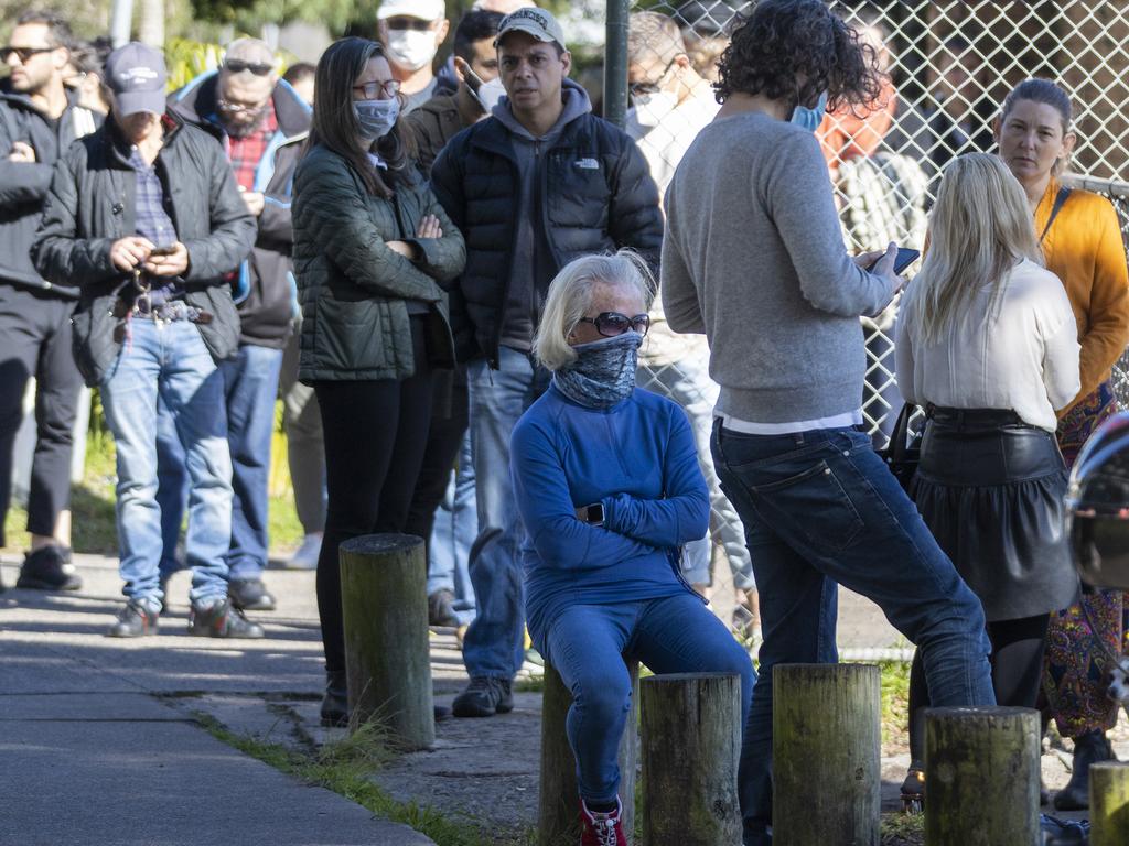 People are seen lining up at a pop-up COVID-19 testing clinic in Rushcutters Bay Sydney after a confirmed case at The Apollo and Thai Rock restaurants in Potts Point. Picture: Jenny Evans/Getty Images
