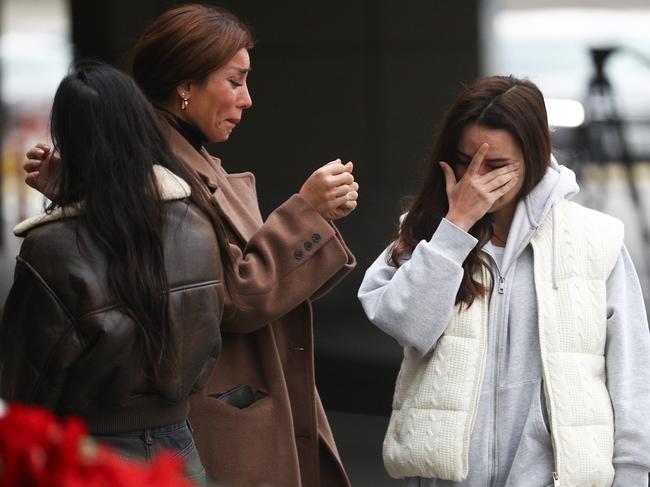 Mourners cry in front of the memorial in Baku, Azerbaijan. Picture: Getty Images