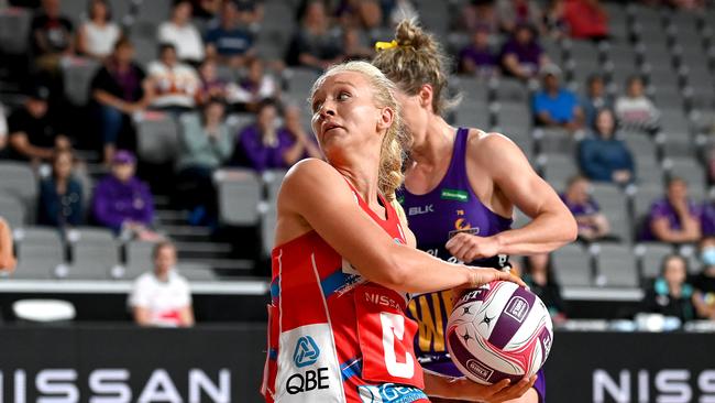 Tayla Fraser in the red dress in Super Netball.