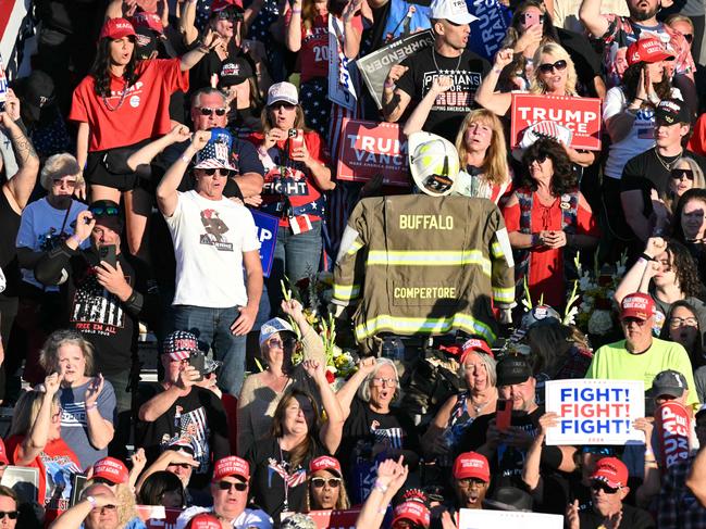 The uniform of slain firefighter Corey Comperatore is seen in the crowd as former US President Donald Trump speaks in Butler, Pennsylvania. Picture: AFP