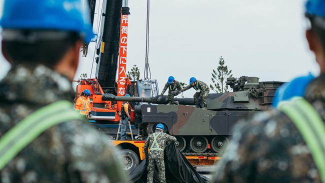 Soldiers secure a US-made M1A2 Abrams battle tank on a trailer at an army armour training centre in Hsinchu County, Taiwan, during the week. Picture: Taiwan's Ministry of National Defence / AFP