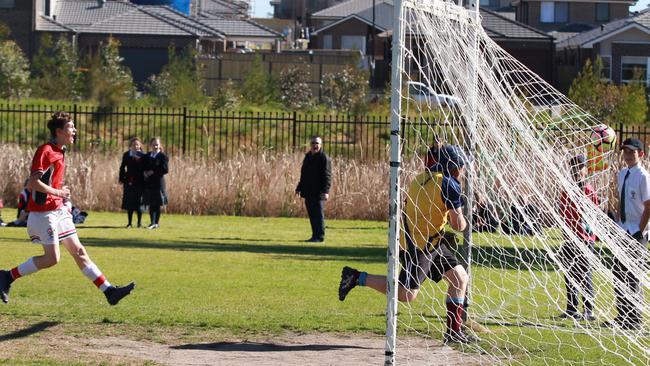 The students celebrate a goal against their seniors. Pictures: Carmela Roche